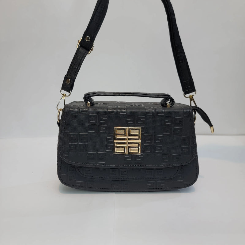 Black embossed leather handbag with a top handle, adjustable shoulder strap, and a gold-toned geometric logo clasp on the front.