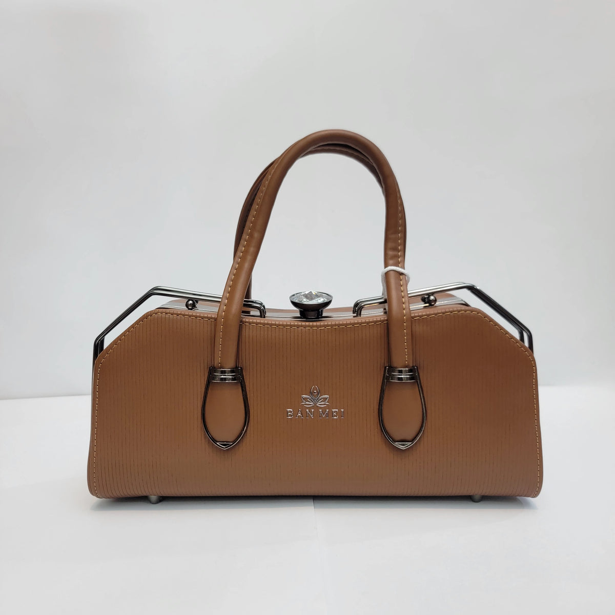 A tan textured leather handbag with double top handles, black metal frame details, and a silver-tone 'FARVEI' logo on the front, set against a plain white background.