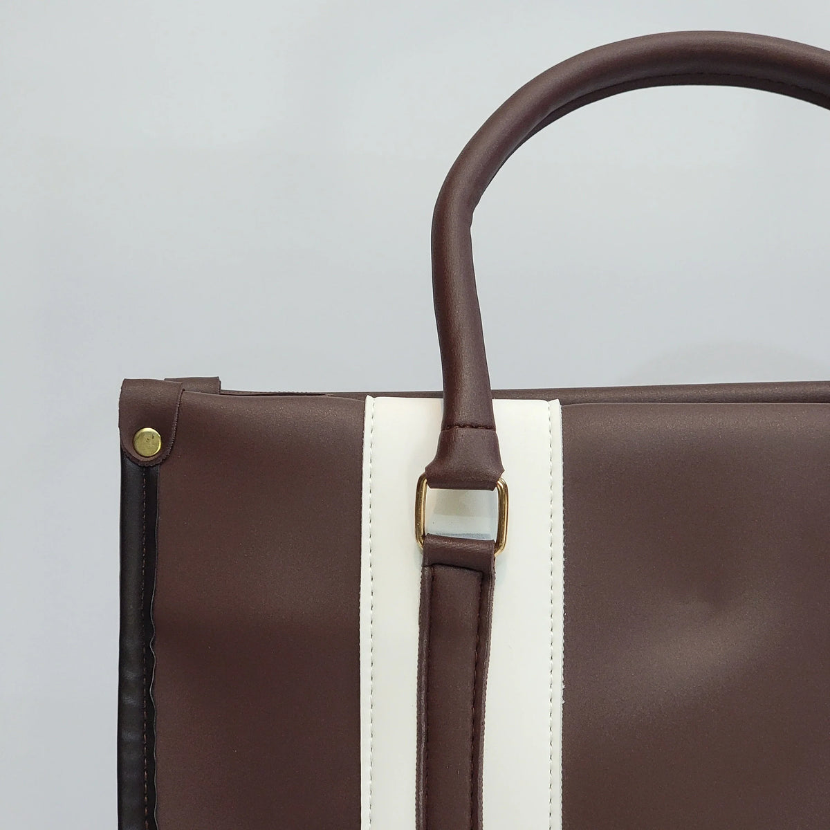 Cross B. coffee brown structured tote bag, close-up of stripe panel and hardware