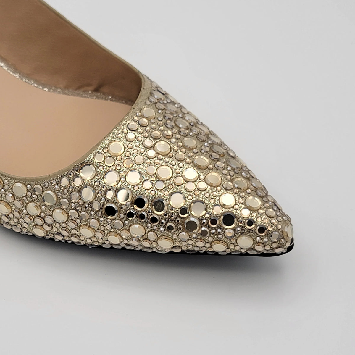 Cross B. golden crystal-embellished slingback heel, close-up of pointed toe