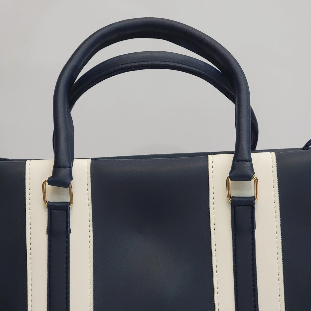 Cross B. navy blue structured tote bag, side view showing handles