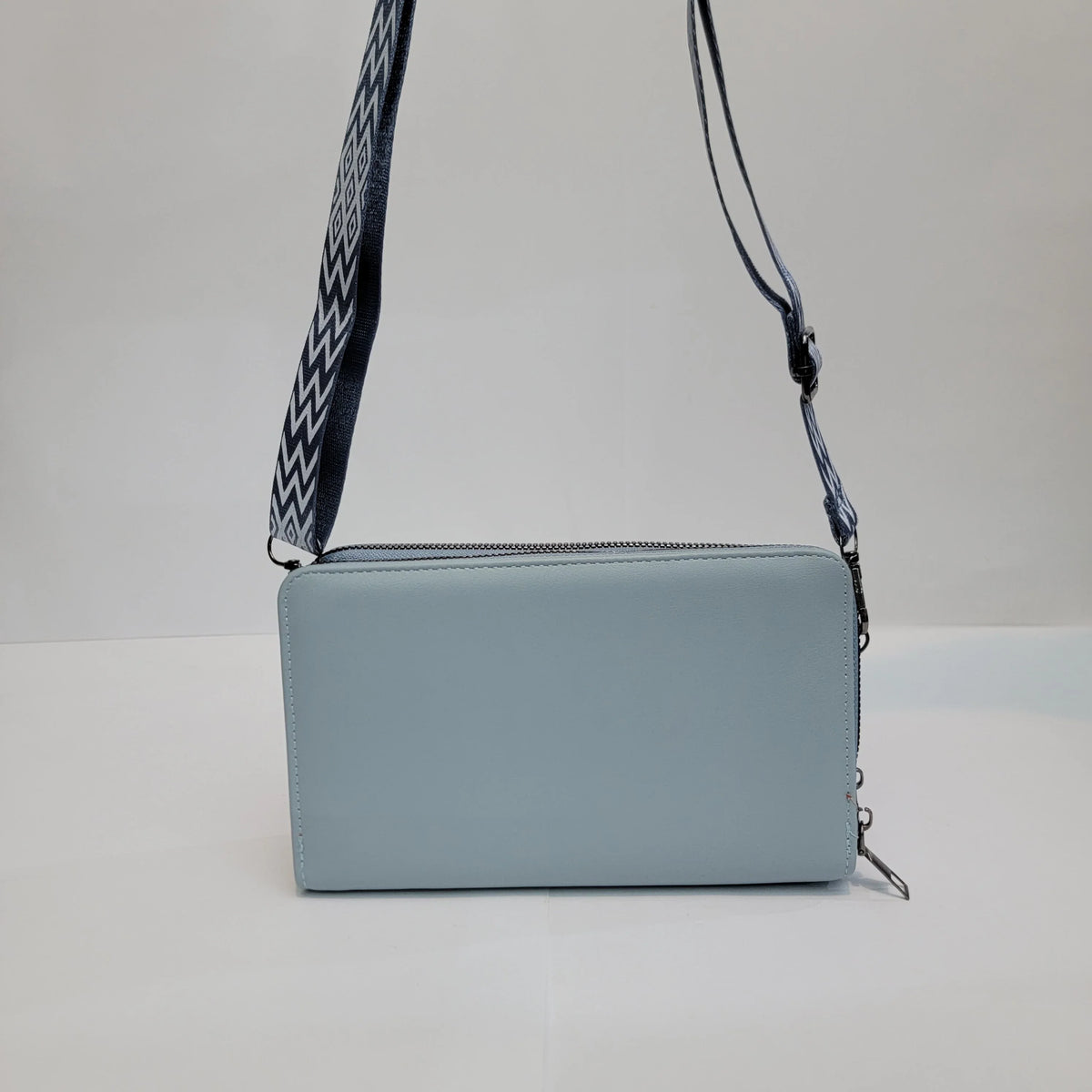 Cross B. blue crossbody bag, side view