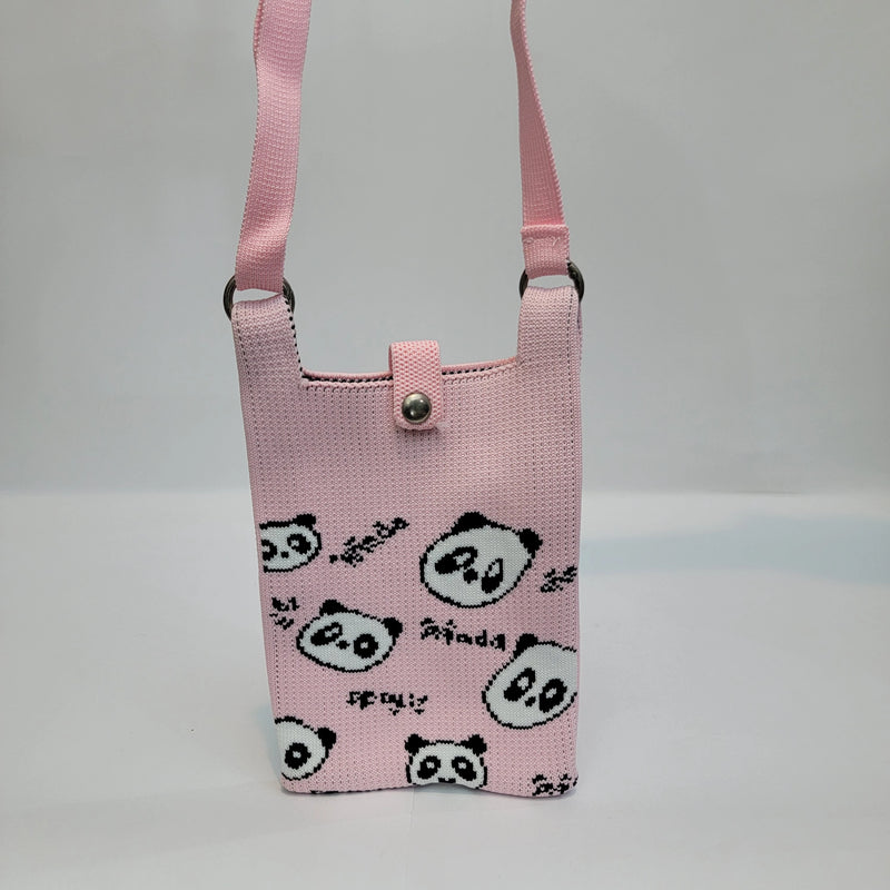 A pink woven crossbody phone bag with an allover black and white panda print, featuring a matching pink strap and a silver snap button closure.