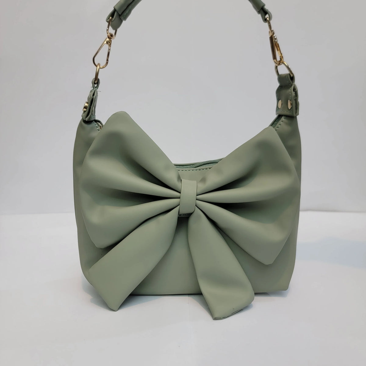 Cross B. bow-detail shoulder bag, front view, third colorway
