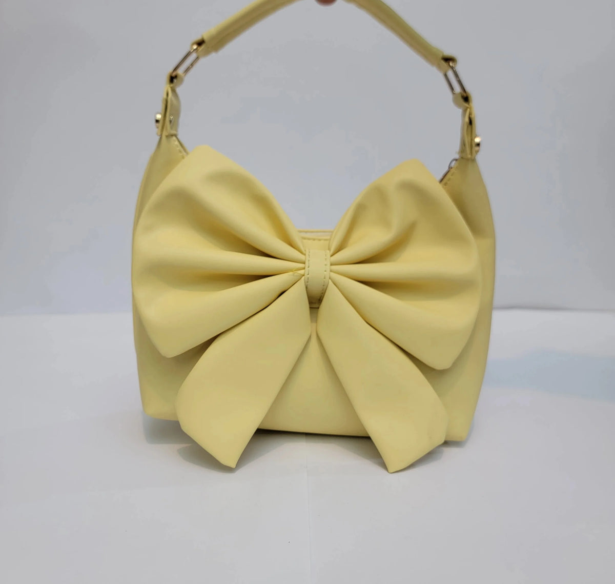 Cross B. bow-detail shoulder bag, front view, fourth colorway