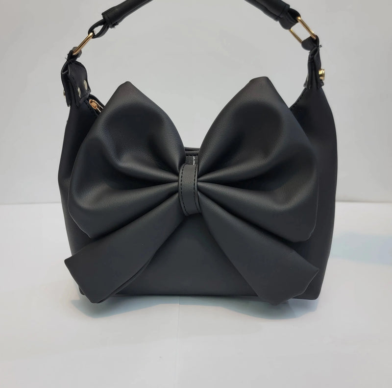 Cross B. bow-detail shoulder bag with gold-tone hardware, front view