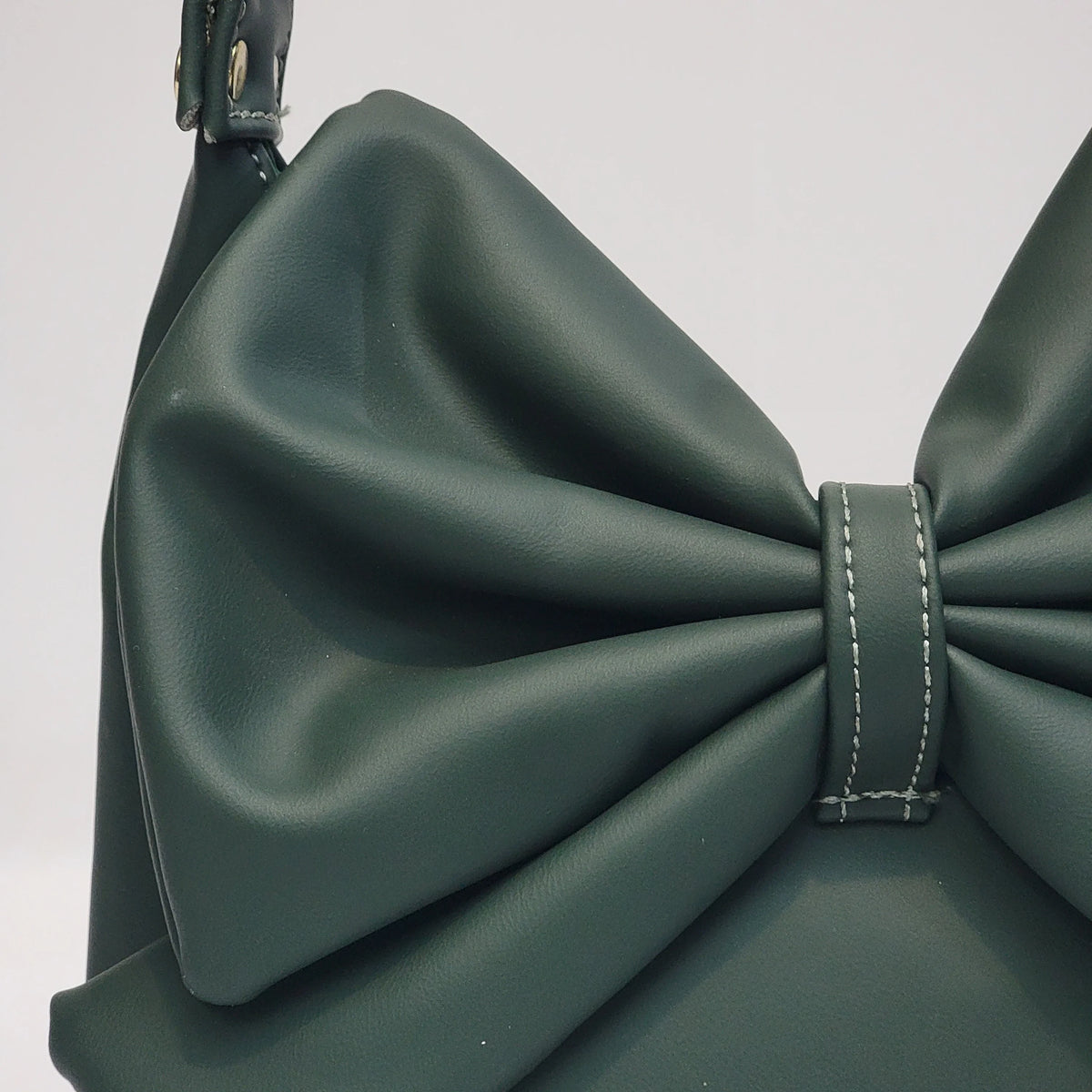 Cross B. bow-detail shoulder bag, close-up of bow and hardware, alternate colorway