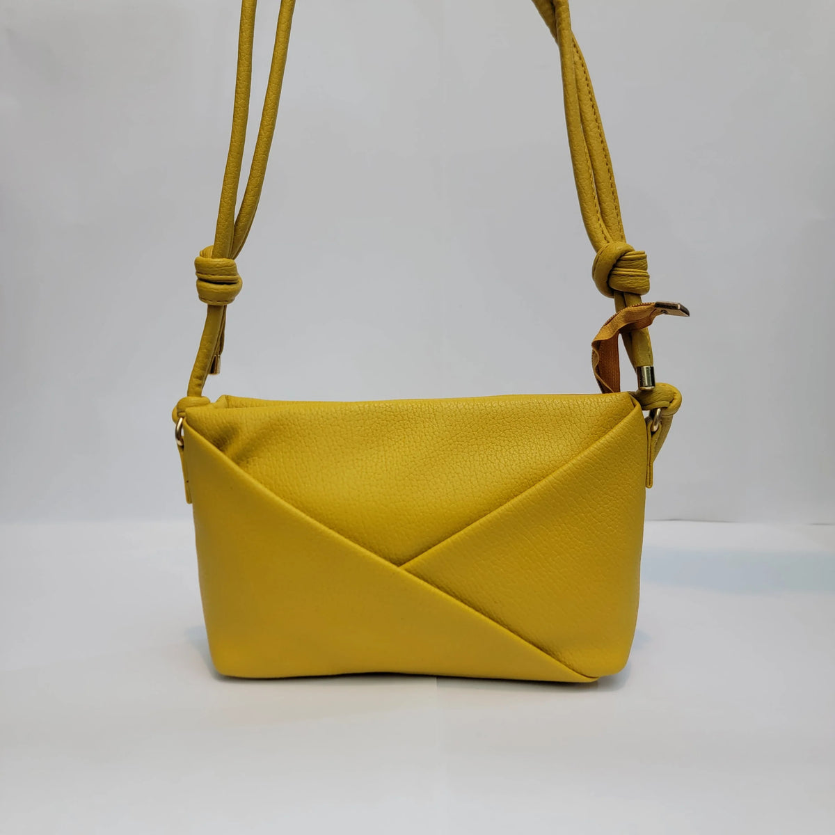 Cross B. yellow envelope-style crossbody bag, front view