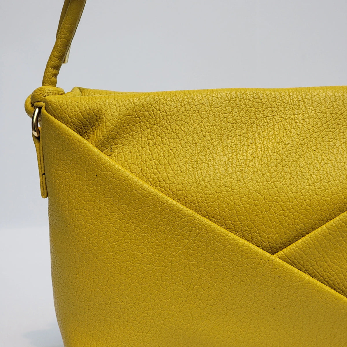 Cross B. yellow envelope-style crossbody bag, side view